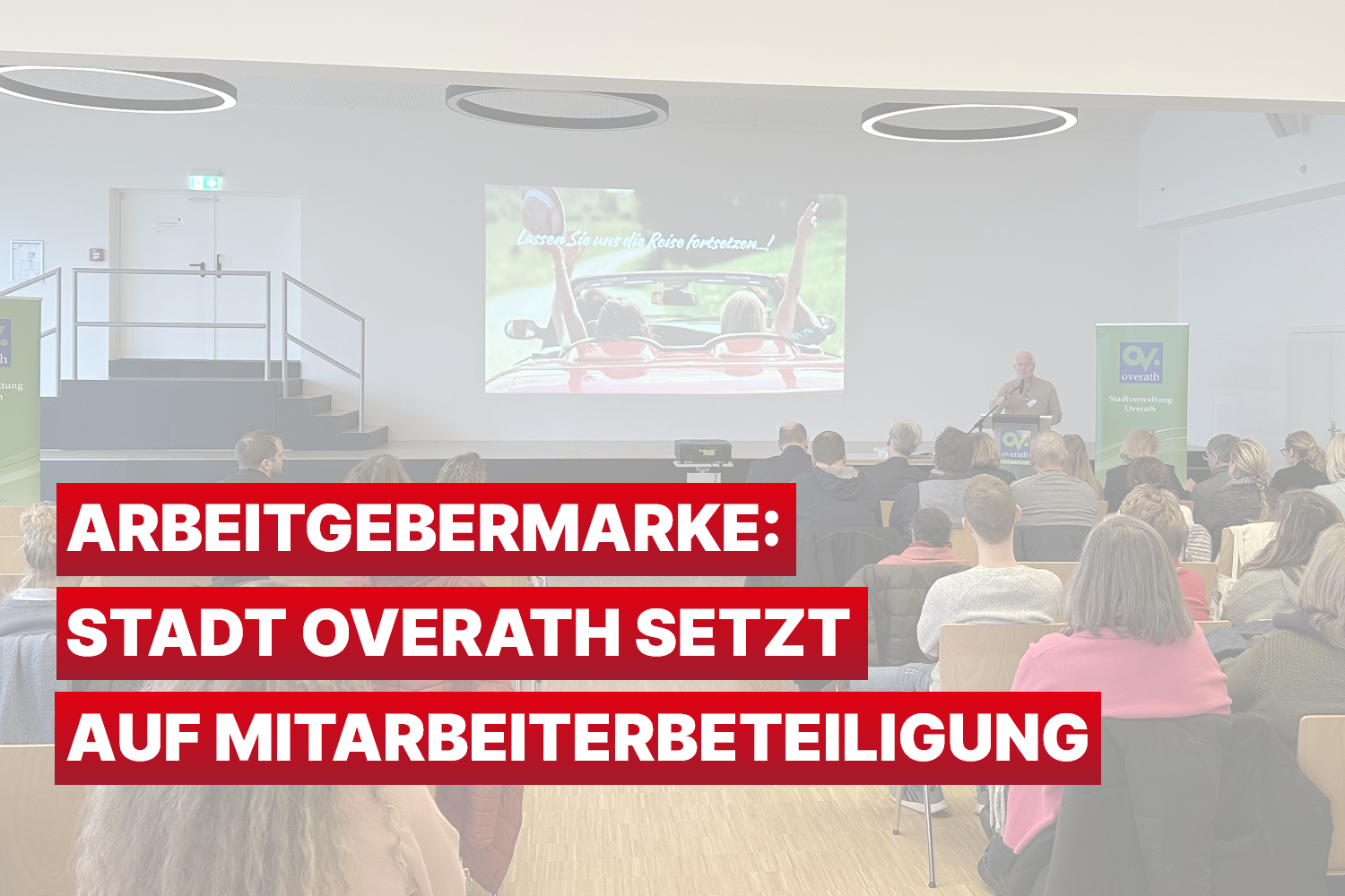 Präsentation der Stadt Overath: Fokus auf Mitarbeiterbeteiligung als Teil der Arbeitgebermarke, mit Teilnehmern und Sprecher im Veranstaltungsraum.